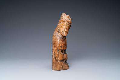 An oak figure of a prophet with traces of polychromy, 16th C.