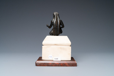 A black-patinated bronze figure of a young lady wearing a loincloth mounted on a marble base, Italy, 16th C.