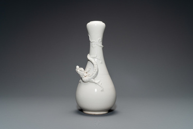 A Chinese Dehua blanc de Chine vase with applied dragon, Kangxi/Yongzheng