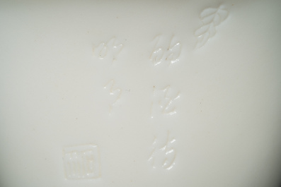 A Chinese Dehua blanc de Chine tripod wine cup with inscription, Kangxi