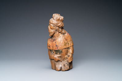 An oak figure of a prophet with traces of polychromy, 16th C.