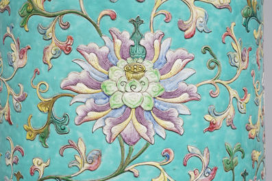A large Chinese famille rose cylindrical vase with applied lotus scrolls, Jiaqing/Daoguang