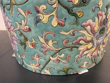 A large Chinese famille rose cylindrical vase with applied lotus scrolls, Jiaqing/Daoguang