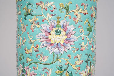 A large Chinese famille rose cylindrical vase with applied lotus scrolls, Jiaqing/Daoguang