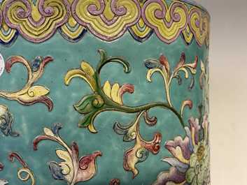 A large Chinese famille rose cylindrical vase with applied lotus scrolls, Jiaqing/Daoguang