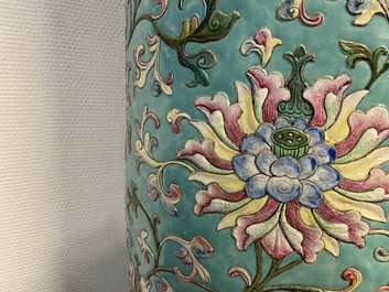 A large Chinese famille rose cylindrical vase with applied lotus scrolls, Jiaqing/Daoguang