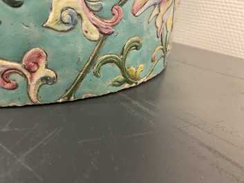 A large Chinese famille rose cylindrical vase with applied lotus scrolls, Jiaqing/Daoguang