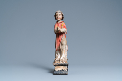 Een gepolychromeerde houten figuur van een biddende engel, ca. 1500