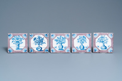 Twenty-five Dutch Delft blue, white and manganese flower vase tiles, 18th C.