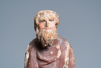 A polychromed oak figure of Saint Thomas on an armorial base, Normandy, France, ca. 1510