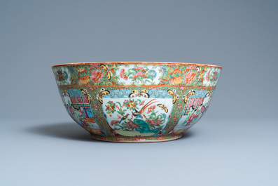 A large Chinese Canton famille rose bowl on wooden stand, 19th C.