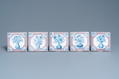 Twenty-five Dutch Delft blue, white and manganese flower vase tiles, 18th C.