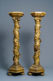 A pair of gilded wooden columns with Ionic capitals, floral swirls and lion paws, Italy, 18th C.
