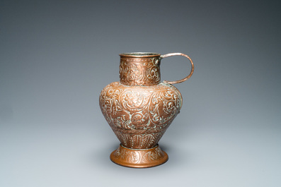 An Italian hammered copper Barberini armorial ewer, 17th C.