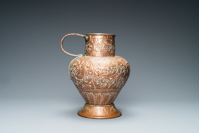 An Italian hammered copper Barberini armorial ewer, 17th C.