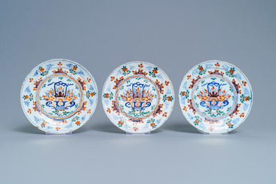 Five polychrome Dutch Delft plates and a dish with flower baskets, 18th C.
