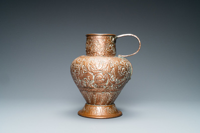 An Italian hammered copper Barberini armorial ewer, 17th C.