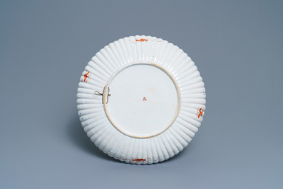 A fluted Dutch Delft dor&eacute; chinoiserie dish with a pagoda in a landscape, 1st quarter 18th C.