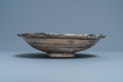 A polychrome Persian pottery dish with geometrical design, 14th C.