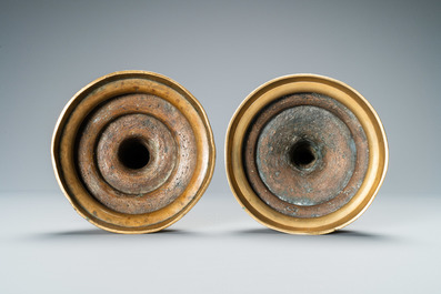 A composite pair of brass alloy candlesticks, Germany, 16th C.