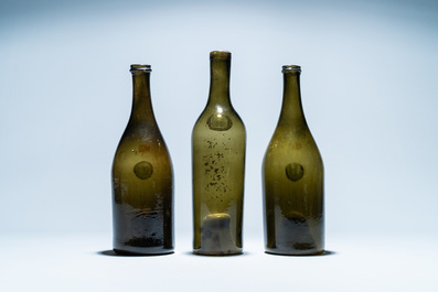 Three green glass wine bottles with crowned seals, 18/19th C.