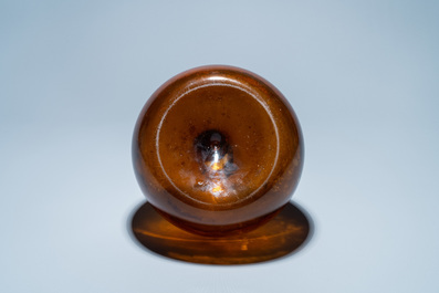 A brown glass bottle, 18th C.