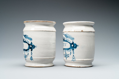 A pair of Dutch Delft blue and white albarello type drug jars, 18th C.