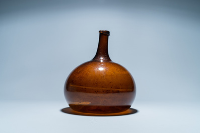 A brown glass bottle, 18th C.
