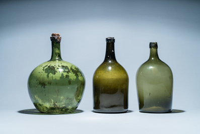 Three large green glass bottles, 18th C.