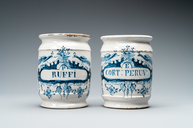 A pair of Dutch Delft blue and white albarello type drug jars, 18th C.