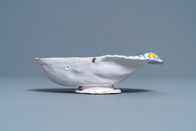 A polychrome faience oval footed bowl with a bathing woman, France, 17th C.