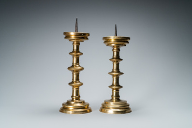A composite pair of brass alloy candlesticks, Germany, 16th C.