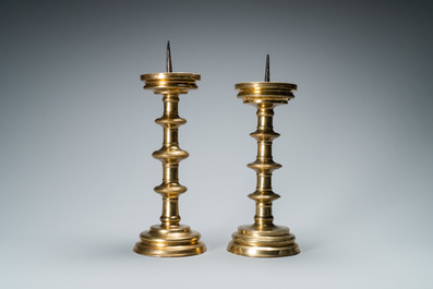 A composite pair of brass alloy candlesticks, Germany, 16th C.