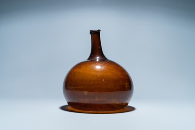 A brown glass bottle, 18th C.