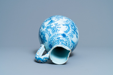 A large Dutch Delft blue and white chinoiserie ewer, 17th C.
