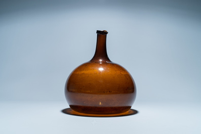 A brown glass bottle, 18th C.