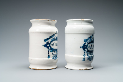 Two Dutch Delft blue and white albarello type drug jars, 18th C.