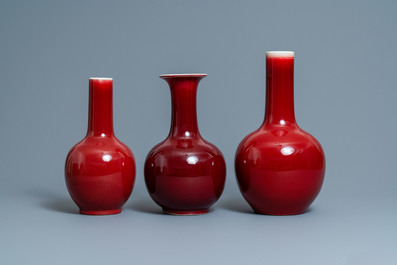 Three Chinese monochrome sang de boeuf-glazed bottle vases, 19/20th C.