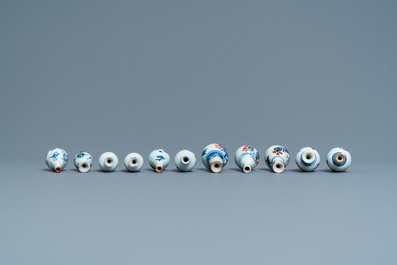 Six Chinese blue and white cups and saucers and eleven miniature vases, Kangxi