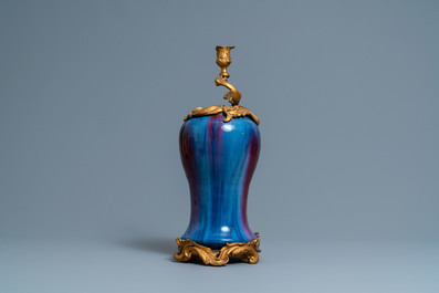 A Chinese flamb&eacute;-glazed vase with gilt bronze candelabra mount, 19th C.
