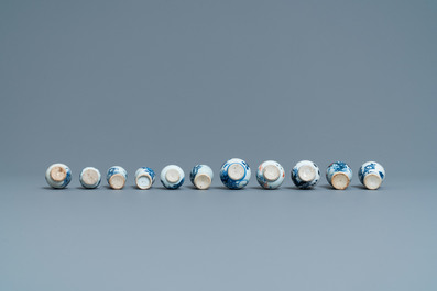 Six Chinese blue and white cups and saucers and eleven miniature vases, Kangxi