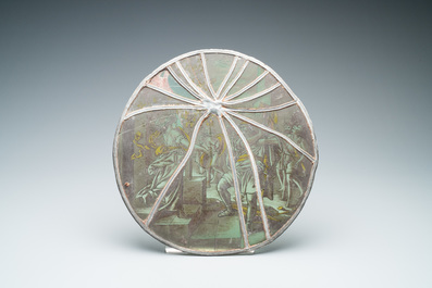 A pair of grisaille and silver yellow painted glass roundels with biblical scenes, France, 17th C.