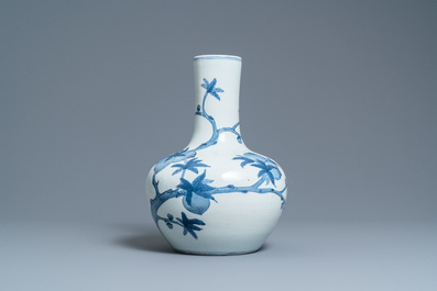 A Chinese blue and white 'tianqiu ping' 'nine peaches' vase, Qianlong mark, 20th C.