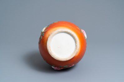 A Chinese famille rose 'sanduo' vase with applied design on a coral red ground, 19th C.
