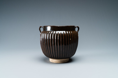 A Chinese black-glazed ribbed two-handled jar, Northern Song or Jin
