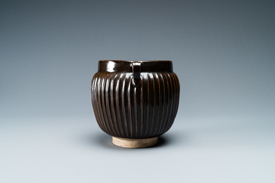 A Chinese black-glazed ribbed two-handled jar, Northern Song or Jin