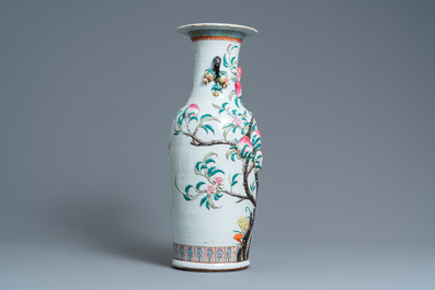 A Chinese famille rose molded 'nine peaches' vase, 19th C.