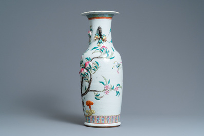 A Chinese famille rose molded 'nine peaches' vase, 19th C.