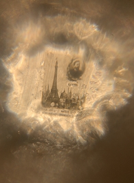 An ivory 'Stanhope' miniature umbrella with microscopical views on Paris, a seal stamp and a bone needle case, 19th C.