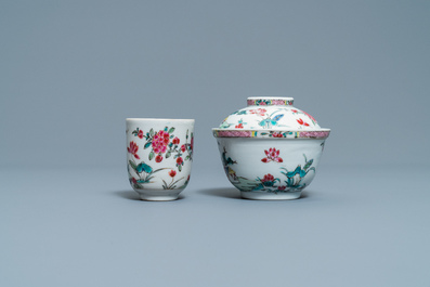 A Chinese famille rose covered bowl, a cup and two saucers with landscape design, Yongzheng